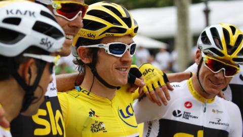 Geraint Thomas celebrates winning the 2018 Tour de France with his Team Sky team-mates