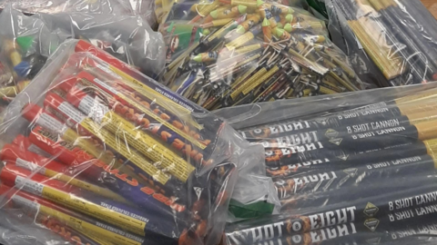 Multiple clear bags of assorted fireworks 