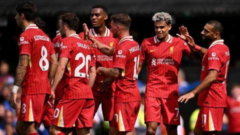 Mohamed Salah celebrates his team-mates after doubling Liverpool's lead over Ipswich Town at Portman Road