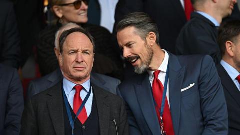Tim Lewis (left) pictured with Josh Kroenke