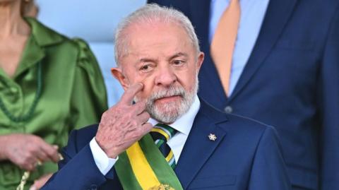 Brazilian President Lula da Silva is shown during the Independence Day parade in Brasilia, on 7 September 2025. He is wearing a blue suit and the yellow-and-green presidential sash.