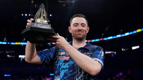 Luke Humphries celebrates winning the 2025 Premier League Darts