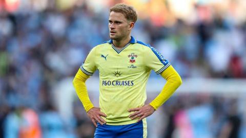 Southampton attacker Leo Scienza in his yellow Southampton jersey at Wembley Stadium