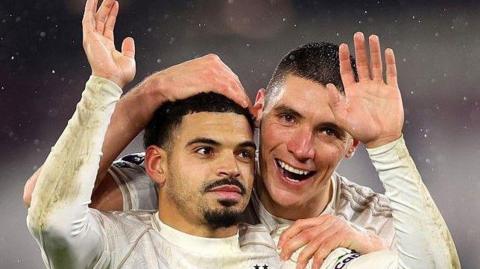 Morgan Gibbs-White celebrates with Nikola Milenkovic