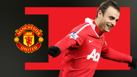 Dimitar Berbatov in front of a Man Utd crest and red background