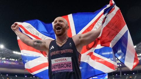 Dan Pembroke celebrates after winning F13 javelin gold