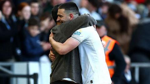 Swansea goalscorer Zan Vipotnik hugs head coach Vitor Matos