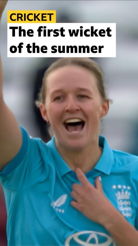 Lauren Filer smiling with one arm up in the air 