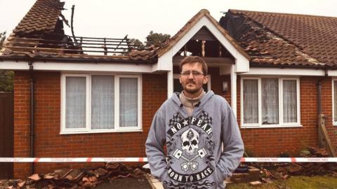 Andy Harrington outside the bungalow at Queensland, Shotley