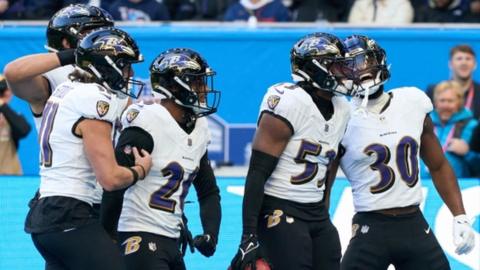 The Baltimore Ravens celebrate against the Tennessee Titans