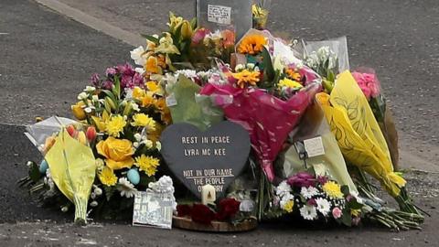 Flowers mark the spot where Lyra McKee was killed in Derry
