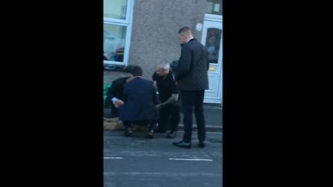 Police arresting a man in Newport