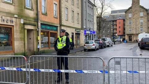 Police officer standing guard near Edinburgh Mosque