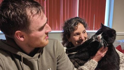 Rescuer Seth Masters pictured with Princess and her owner Sonia Wilkinson