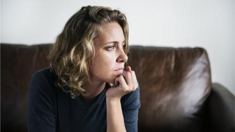 woman sitting on a sofa