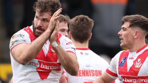 Alex Walmsley celebrates a try for St Helens