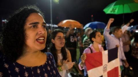 People protest at the headquarters of the Central Electoral Board, after municipal elections were suspended, in Santo Domingo, Dominican Republic, 16 February 2020.