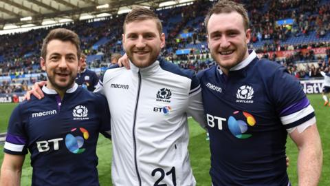 Greig Laidlaw, Finn Russell and Stuart Hogg after Scotland's win over Italy