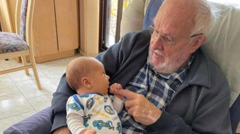 James Harrison with his grandson, Trey, in an earlier picture