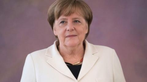 German Chancellor Angela Merkel waits to be given her certificate of appointment by the German president on 14 March 2018