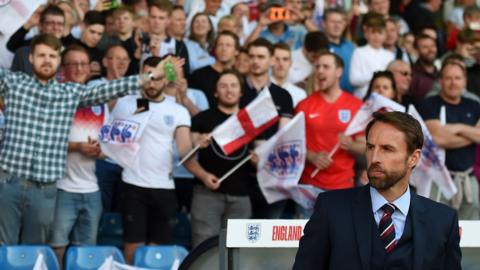 Gareth Southgate watches on in front of the England supporters