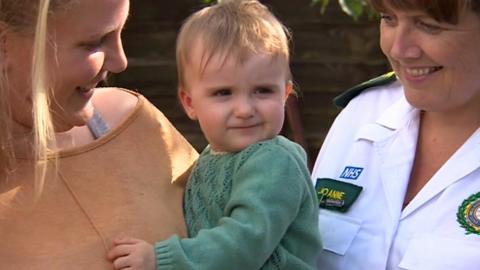 baby with mum and paramedic