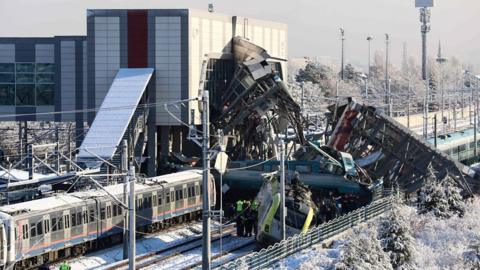 Survivors are pulled from the wreckage after a high-speed train crashed in Ankara, killing nine people.