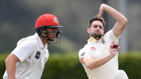 England all-rounder Chris Woakes bowls during a tour match against a New Zealand XI