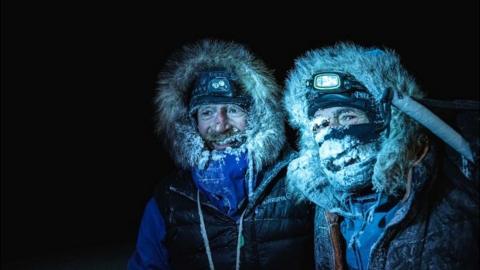 Picture handed out by the Mike Horn Sarl shows Borge Ousland (L) of Norway and South African-born Swiss Mike Horn on 8 December 2019 after arriving at the Lance icebreaker boat in Norwegian waters of the Arctic Ocean