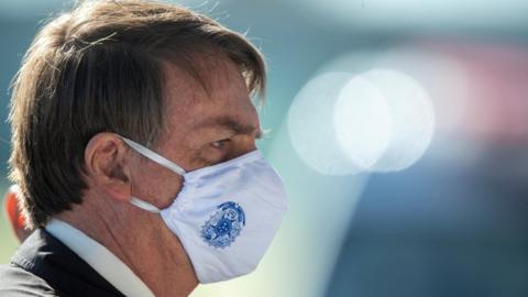 Brazilian President Jair Bolsonaro wears a face mask