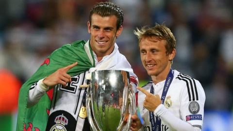 Real Madrid's Gareth Bale and Luke Modric celebrate winning the 2014 Super Cup against Sevilla in Cardiff