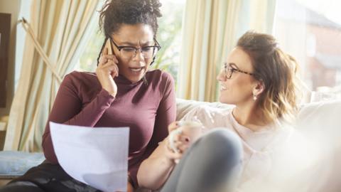 Woman on phone discussing energy bill