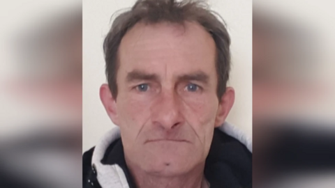 A mugshot of Andrzej Mucha, who has short, brown hair.