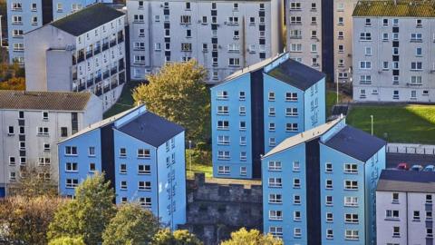 An aerial view of rows of flats from a distance