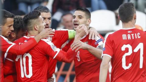 Aleksandar Mitrovic celebrates with team-mates