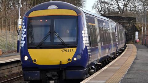 A ScotRail train pulls into a station in Fife