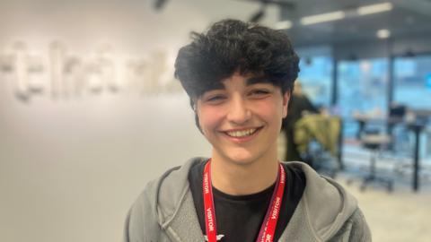 Photograph of seventeen year-old Dylan Nomovi from Middleton He is pictured in an office in Manchester city centre.