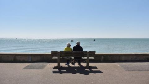 Couple looking out to sea