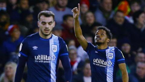 Duane Holmes celebrates his goal