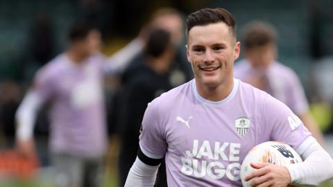 Macaulay Langstaff with the hat-trick ball after Nott County's win at Yeovil