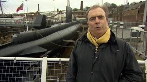 Peter Hitchens at a dockyard