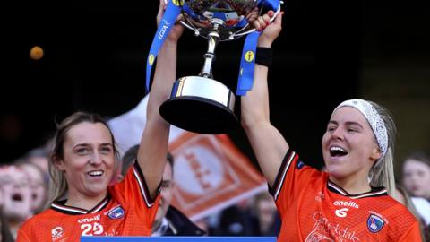 Armagh pair Eve Lavery and Lauren McConville lift the Division One trophy