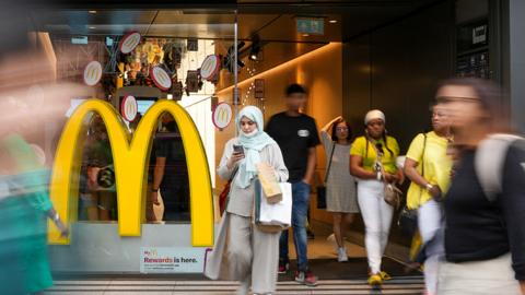 People walk past McDonald's store in London, Britain July 27, 2022