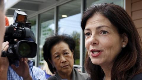 Kelly Ayotte talks to reporters Tuesday Oct. 4, 2016 in Hudson, N.H.