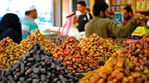 Saudi's buy dates at a shop in Jeddah ahead of the Muslim holy fasting month of Ramadan on May 24, 2017.