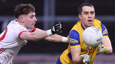 Tyrone's Niall Devlin challenges David Murray