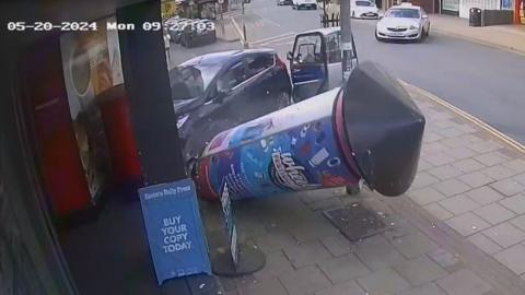 CCTV footage of a car crashing into a postbox.