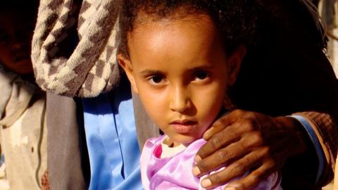 Young girl looking at the camera