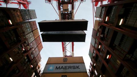 Containers are seen unloaded from the Maersk's Triple-E giant container ship Maersk Majestic at the Yangshan Deep Water Port, part of the Shanghai Free Trade Zone, in Shanghai, China (24 September 2016)