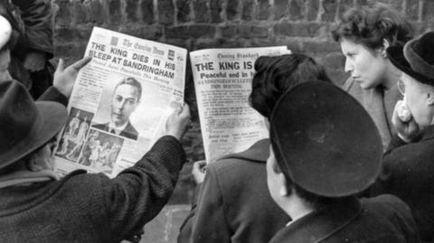 People read the front page announcing the King's death